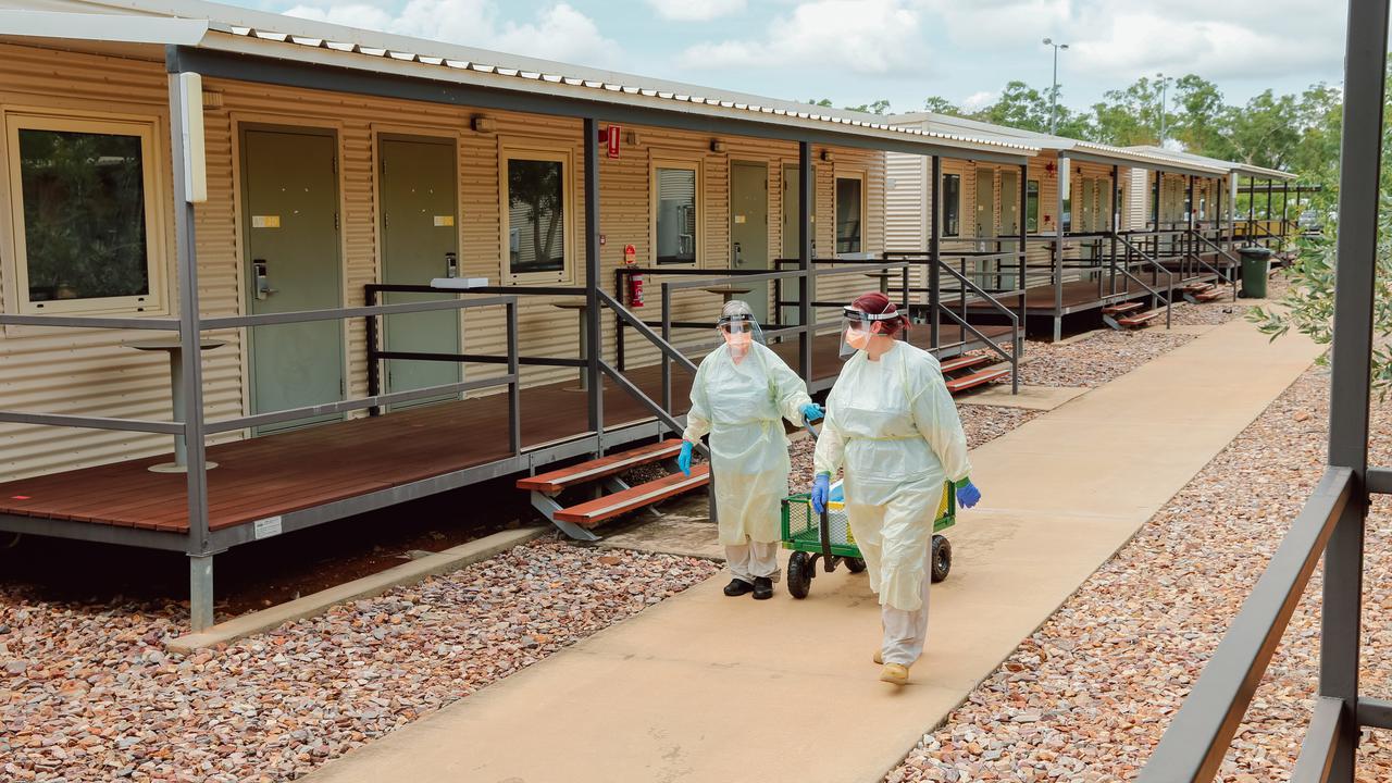 Two people isolating at a Tanami Desert mine were to be transferred to the Howard Springs centre.