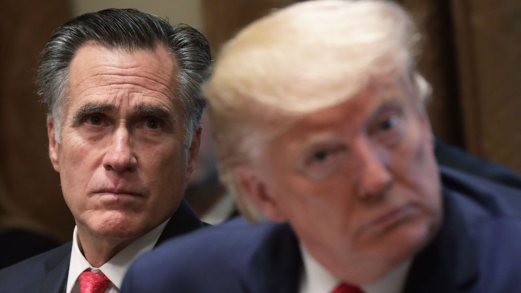 Sen. Mitt Romney (R-Utah) and then-President Donald J. Trump attend a policy information session in the Cabinet Room of the White House in Washington, D.C., in November 2019. (Alex Wong/Getty Images)