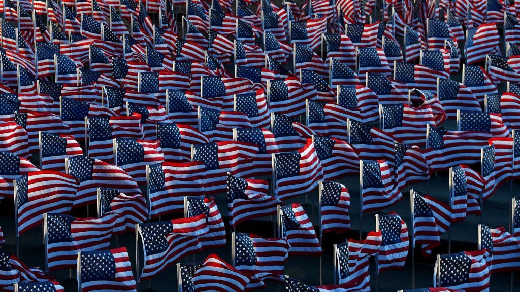 Heavily Guarded Nation's Capital Hosts Presidential InaugurationbrWASHINGTON, DC - JANUARY 20: American flags decorate the Field of Flags at the National Mall near the U.S. Capitol early morning ahead of the inauguration of U.S. President-elect Joe Biden on January 20, 2021 in Washington, DC. During today's inauguration ceremony Joe Biden becomes the 46th president of the United States. (Photo by Stephanie Keith/Getty Images)