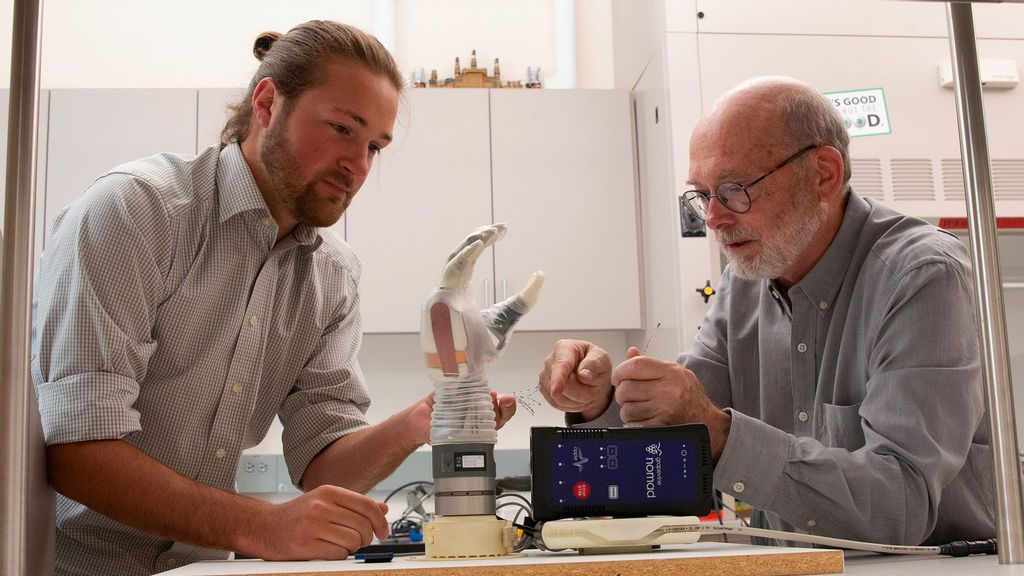 University of Utah student Jacob George and associate professor Gregory Clark work with the LUKE arm. (Dan Hixson/University of Utah College of Engineering/Zenger News)