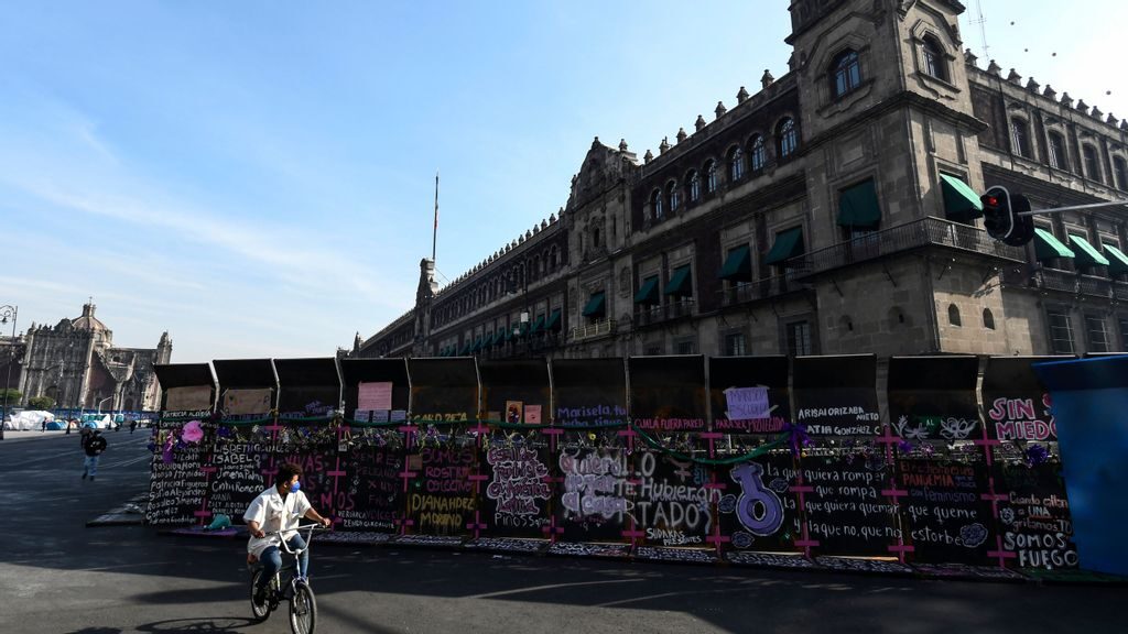 Signs denouncing gender violence cover the fences placed outside the National Palace in anticipation of protests on International Women's Day, March 8, 2021, in Mexico City. Mexican organizations have accused several candidates in the June 6 election of gender violence. (Karen Melo/Getty Images)