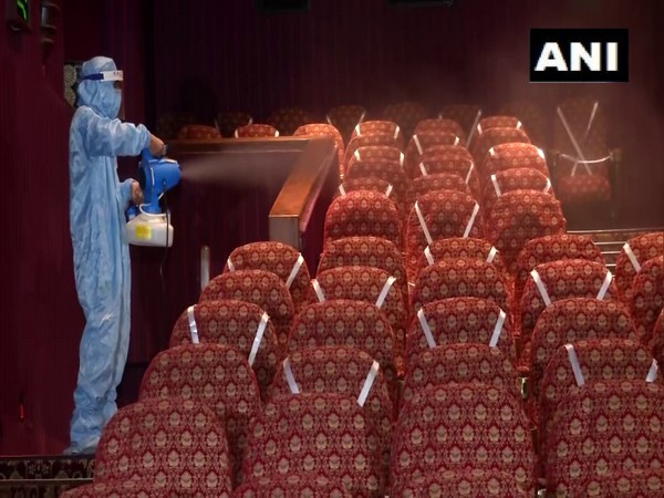 Seats at a movie theatre being sanitised. (Photo/ANI)