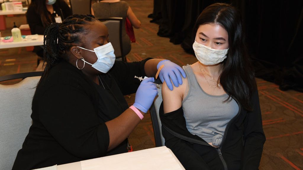 A medical assistant administer the Pfizer vaccine to a student at the University of Nevada - Las Vegas on Jan. 12. (Ethan Miller/Getty Images)