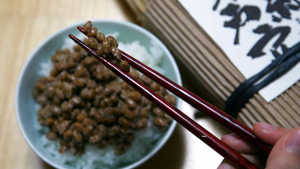 A person dines on a dish of natto; a traditional Japanese dish made from steamed and fermented soybeans, served with white rice in Mito, Japan. (Koichi Kamoshida/Getty Images)