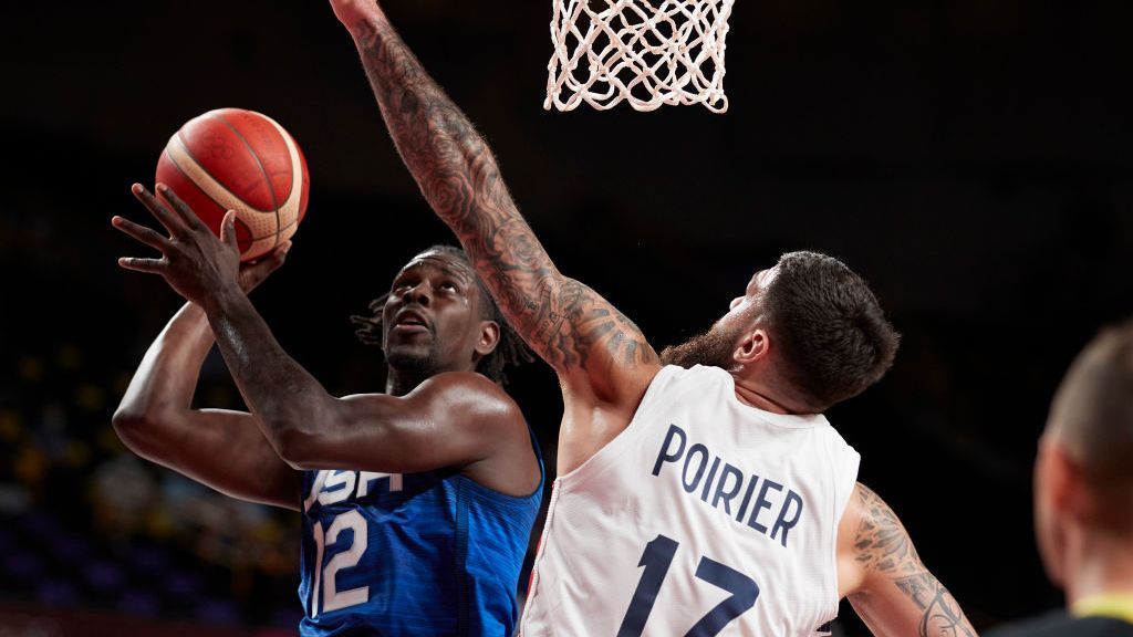 Jrue Holiday of USA and Vincent Poirier of France battle for the ball on day two in the Men's First Round Group A match between France and USA at the Tokyo 2020 Olympic Games at Saitama Super Arena on July 25, 2021 in Saitama, Japan. (Photo by Berengui/DeFodi Images via Getty Images)