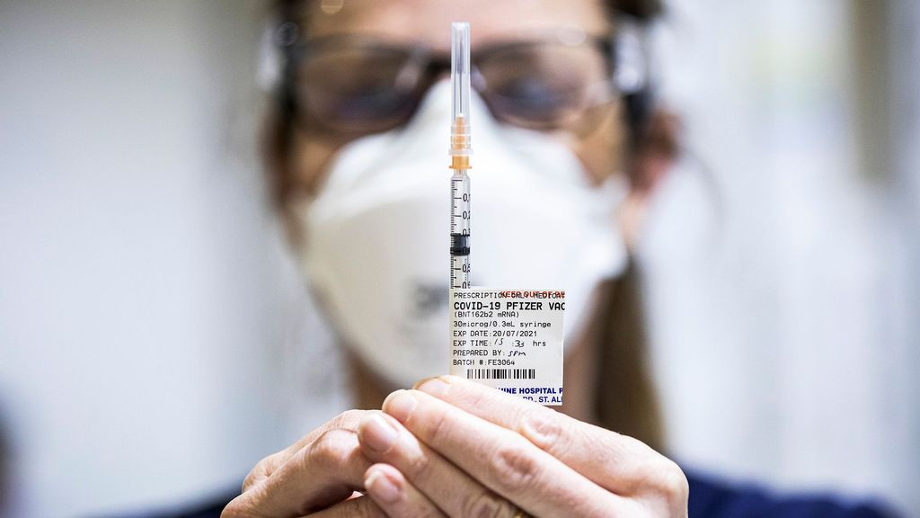 Staff are seen preparing Pfizer vaccine doses inside the Melbourne Showgrounds COVID-19 Vaccination Centre on July 20, 2021 in Melbourne, Australia. (Daniel Pockett/Getty Images)